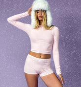 Millie Bobby Brown wears red knitted crop top and trousers