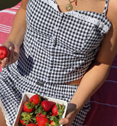 Millie Bobby Brown wears red knitted crop top and trousers