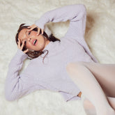 Millie Bobby Brown wears red knitted crop top and trousers