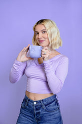 Millie Bobby Brown wears red knitted crop top and trousers