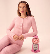 Millie Bobby Brown wears red knitted crop top and trousers