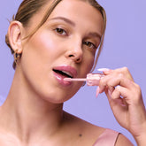 Millie Bobby Brown wears red knitted crop top and trousers